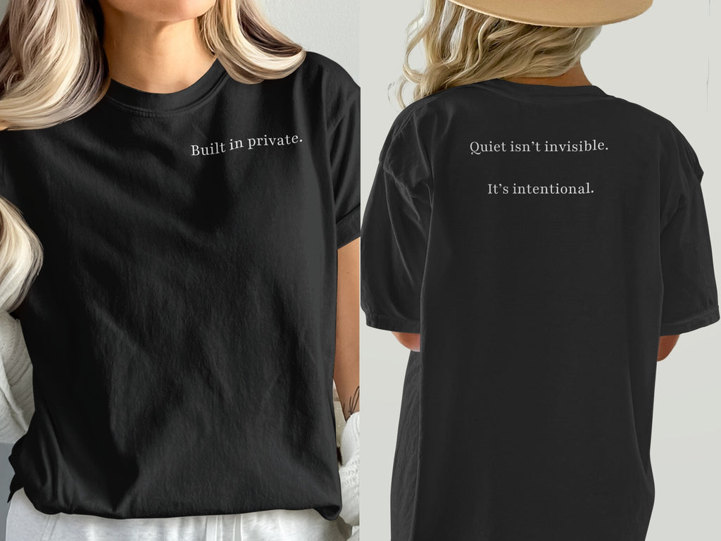 Black t-shirt with white text: "Built in private." on front, "Quiet isn't invisible. It's intentional." on back.