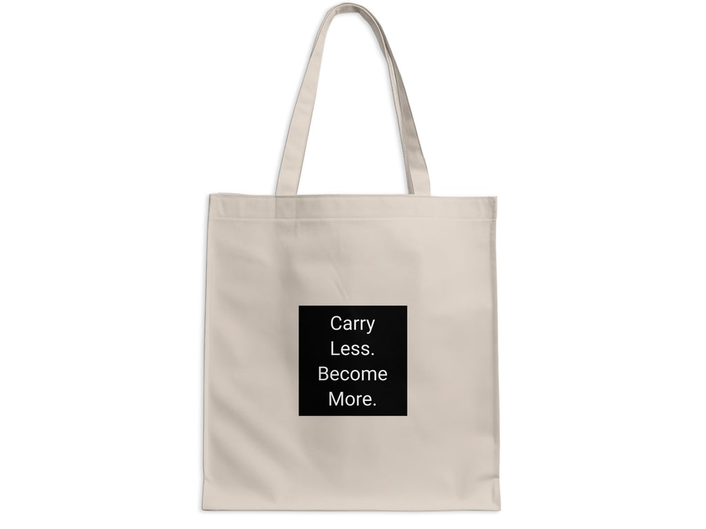 Beige tote bag with black square featuring white text: Carry Less. Become More.